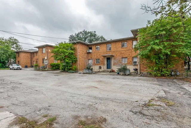 a view of a house with a yard and a garage
