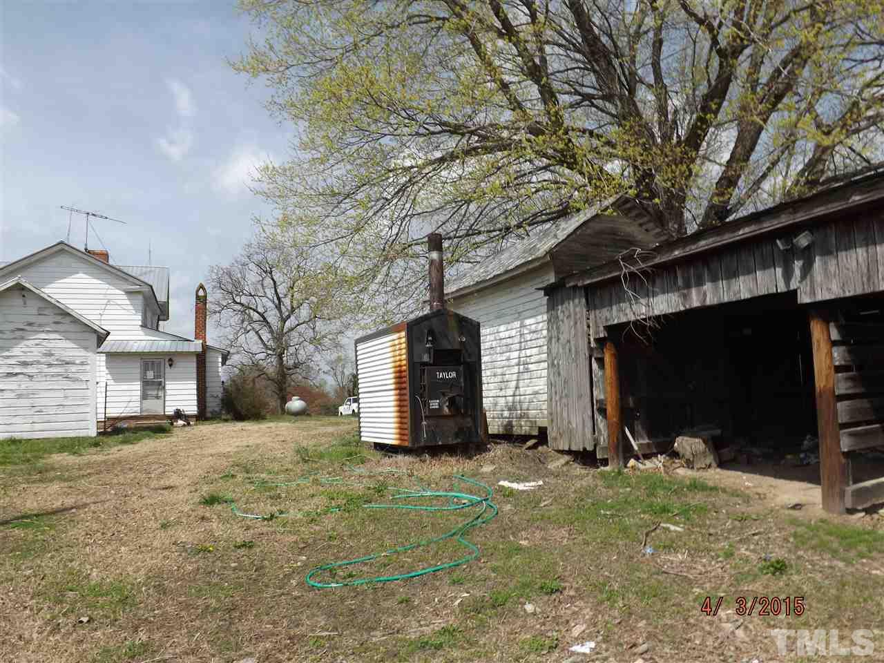 6119 Foushee Road Ramseur, NC 27316 - Photo 2 of 16 a view of a house with a yard and large tree