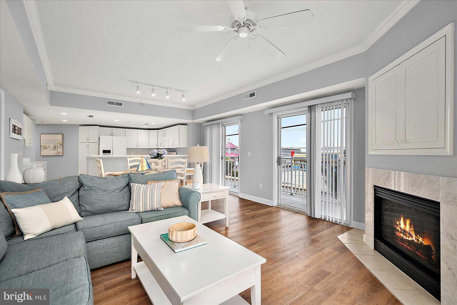 5300 Coastal Highway, Unit 101 Ocean City, MD 21842 - Photo 14 of 85 a living room with furniture and a fireplace