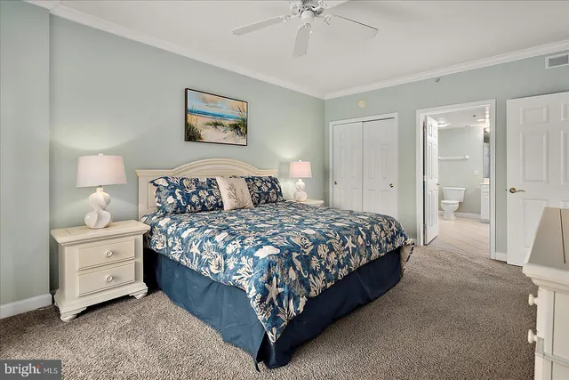 a bedroom with a bed and a table