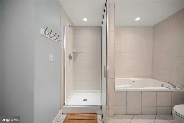 a spacious bedroom with two bed and a window