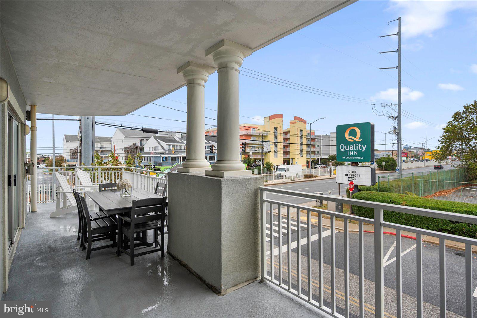5300 Coastal Highway, Unit 101 Ocean City, MD 21842 - Photo 45 of 85 a view of a chairs and table in patio with a lake view