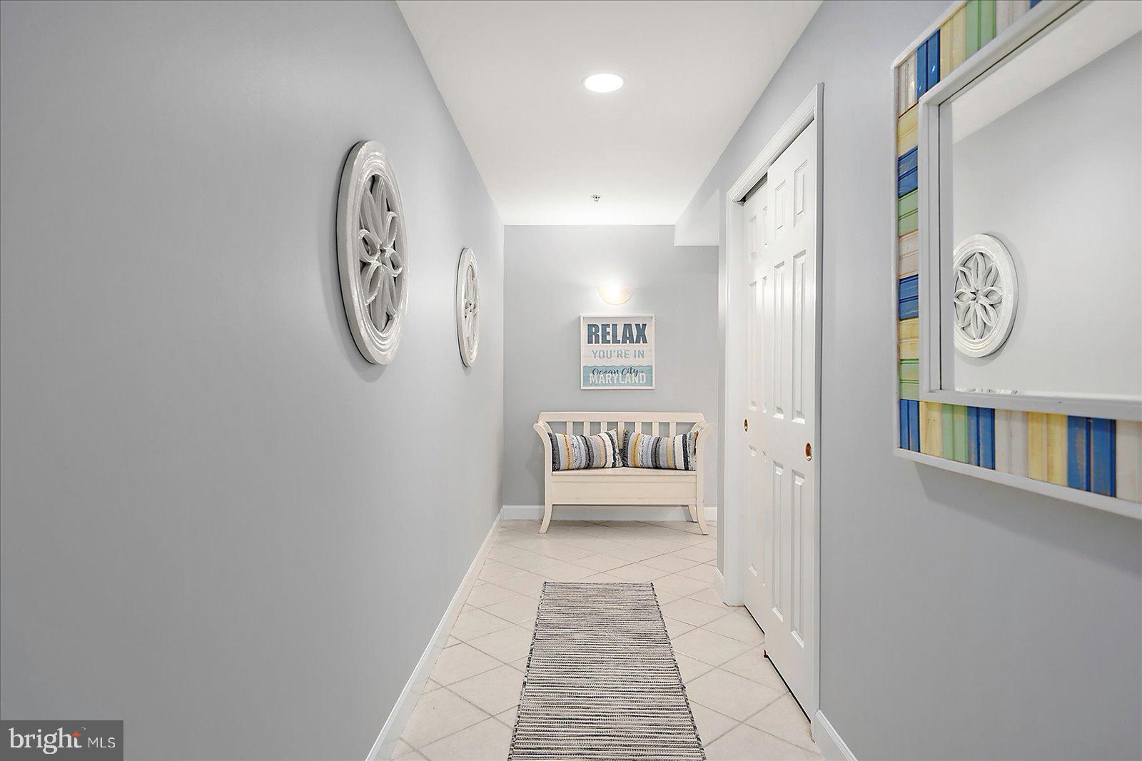 5300 Coastal Highway, Unit 101 Ocean City, MD 21842 - Photo 6 of 85 a view of a hallway with entryway