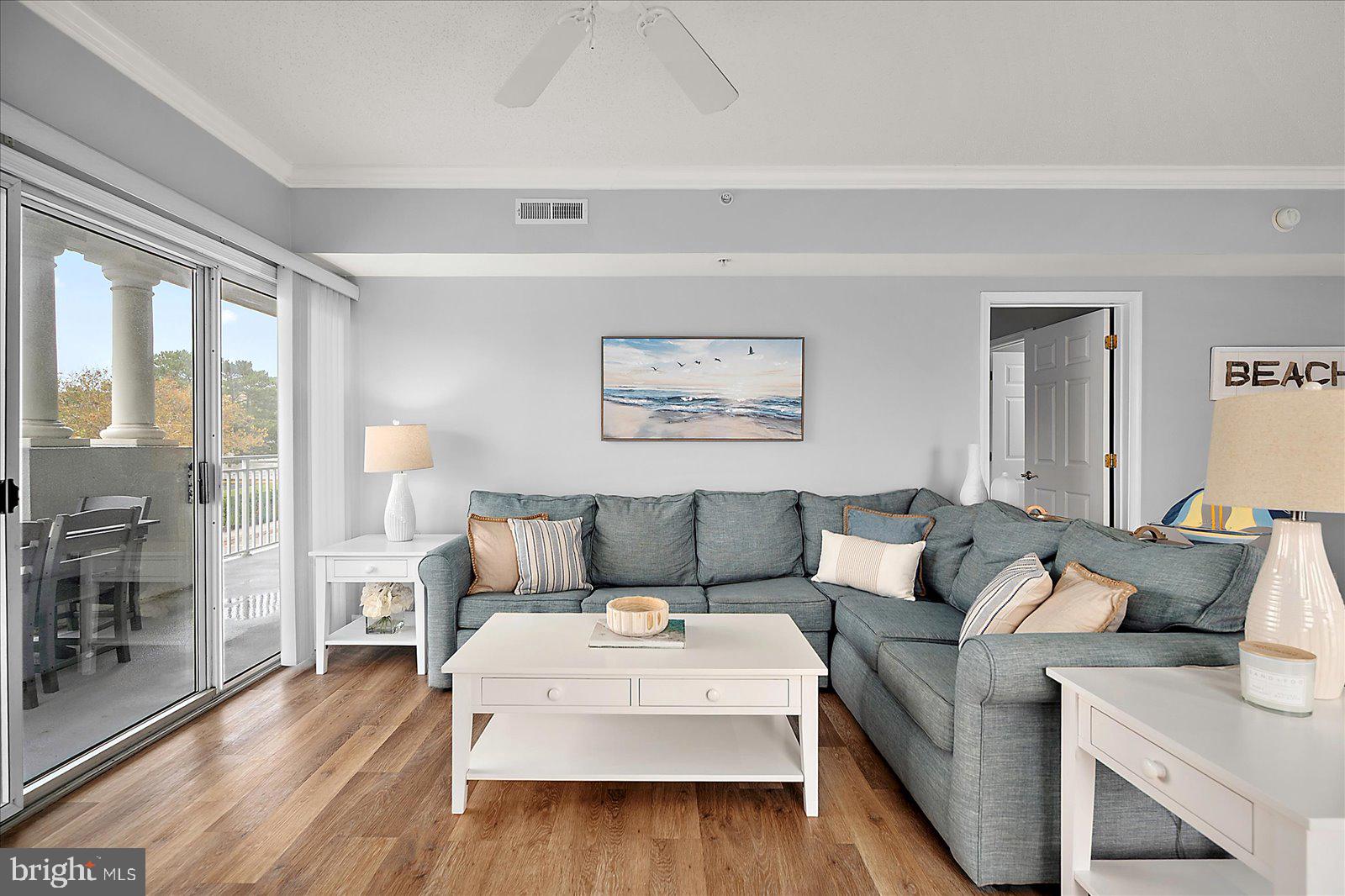 5300 Coastal Highway, Unit 101 Ocean City, MD 21842 - Photo 9 of 85 a living room with furniture and wooden floor