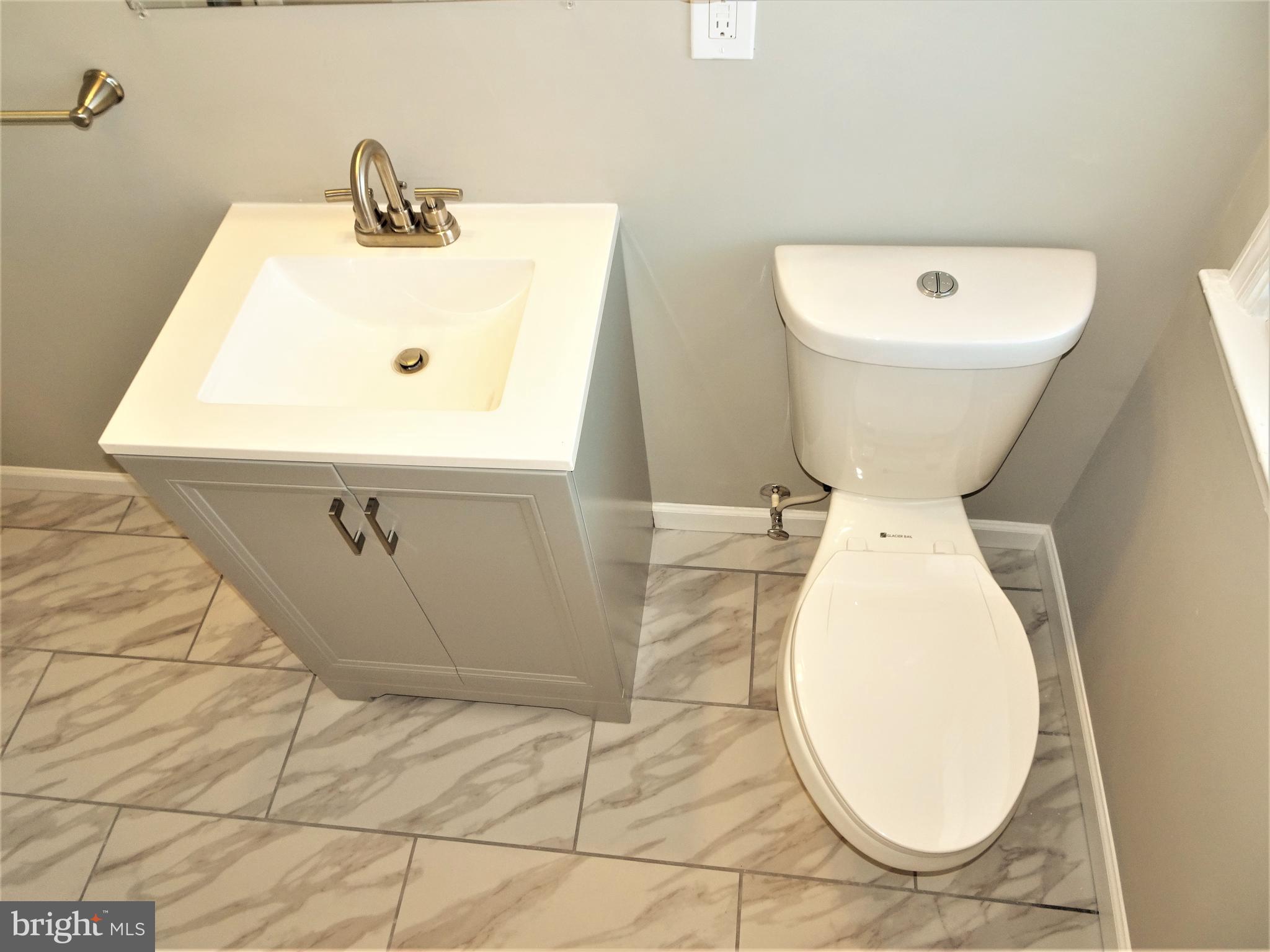 1217 Cedarcroft Road Baltimore, MD 21239 - Photo 19 of 46 Dual flush toilets