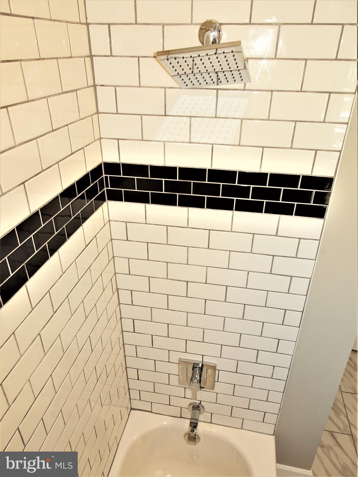 1217 Cedarcroft Road Baltimore, MD 21239 - Photo 20 of 46 Subway tile and upgraded plumbing fixtures