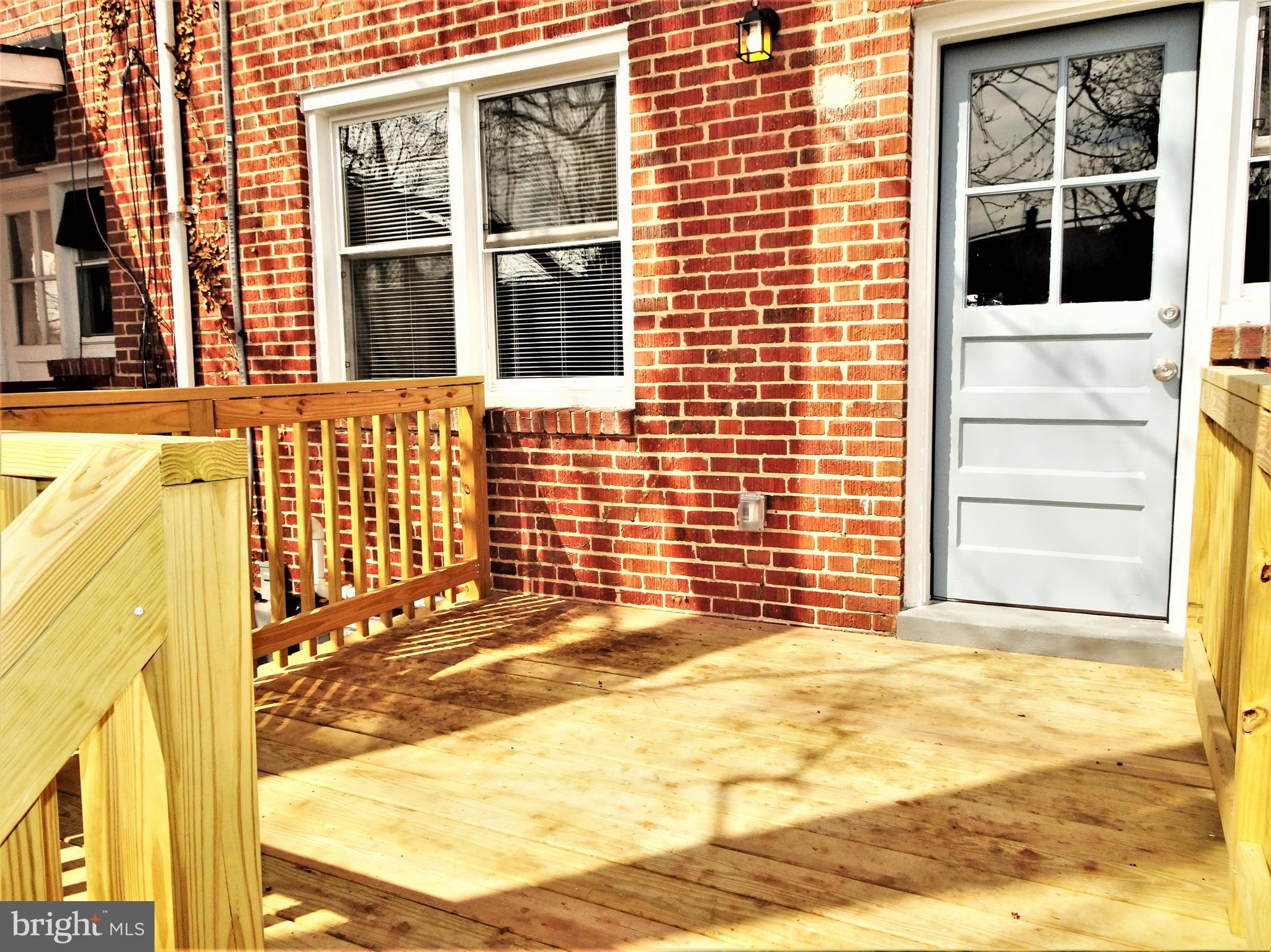 1217 Cedarcroft Road Baltimore, MD 21239 - Photo 36 of 46 Deck off kitchen great for entertaining or dinning