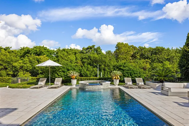 a view of a swimming pool with a patio