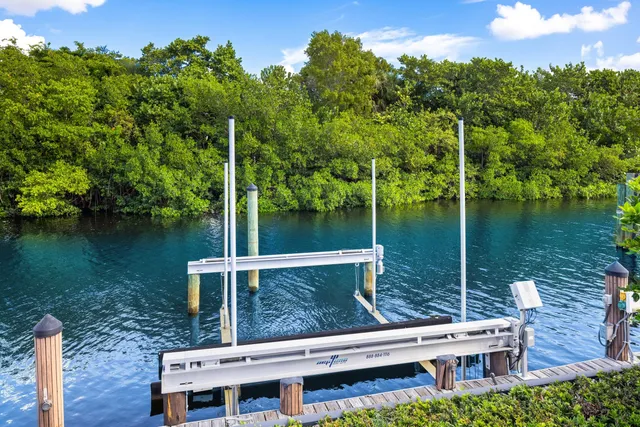 a view of a lake with chairs