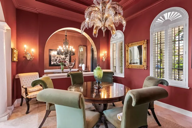 a view of a dining room with furniture and a chandelier