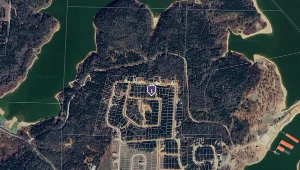 a aerial view of multi story residential apartment building with yard