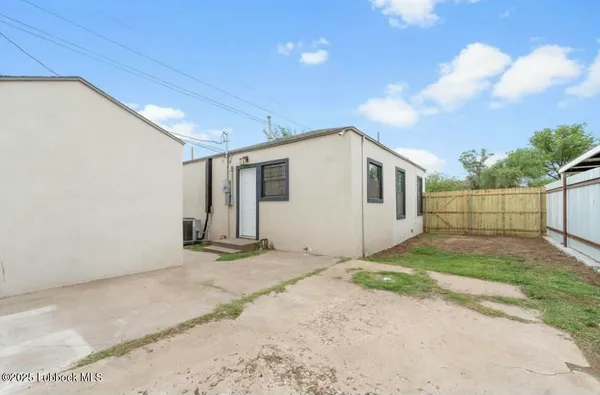 a view of a backyard of the house