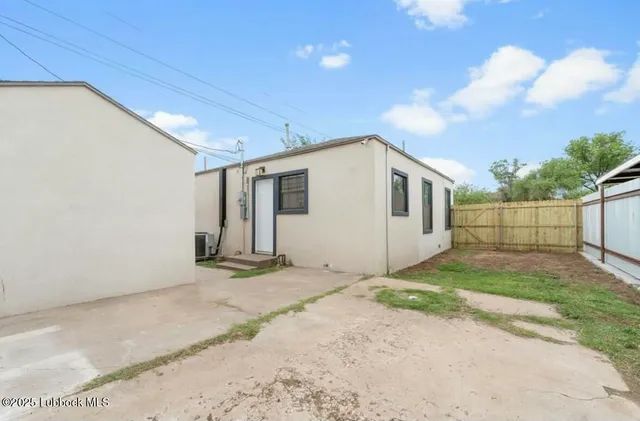 a view of a backyard of the house