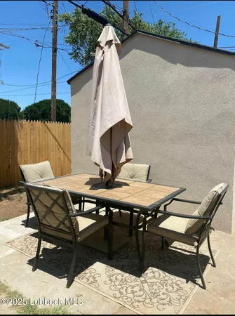 a view of a terrace with furniture and stove