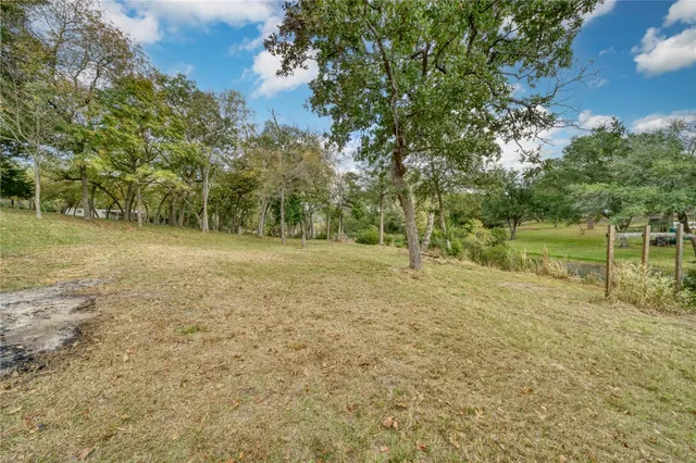 a bedroom with a bed and a wooden table