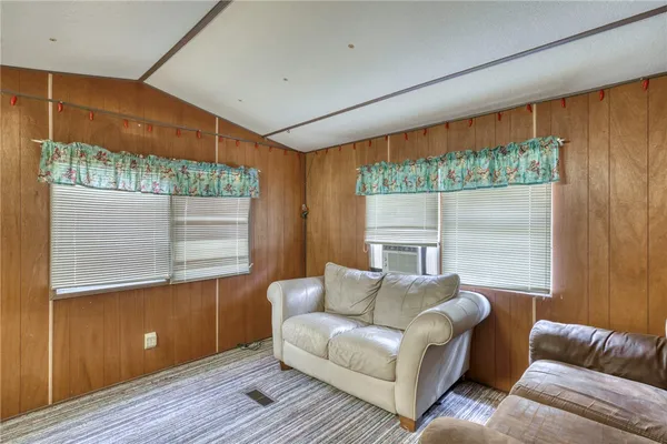 a kitchen with refrigerator and cabinets