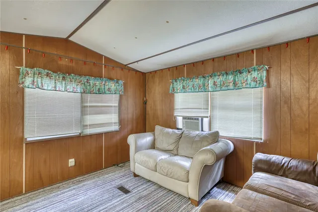a kitchen with refrigerator and cabinets