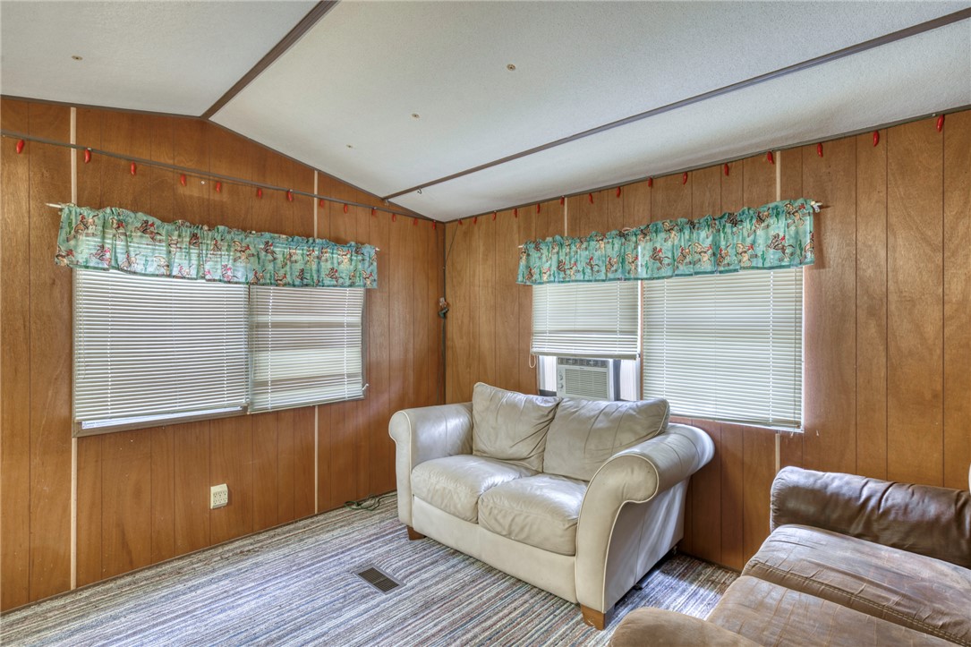 10232 Riley Green Road Franklin, TX 77856 - Photo 25 of 40 a living room with furniture and a flat screen tv
