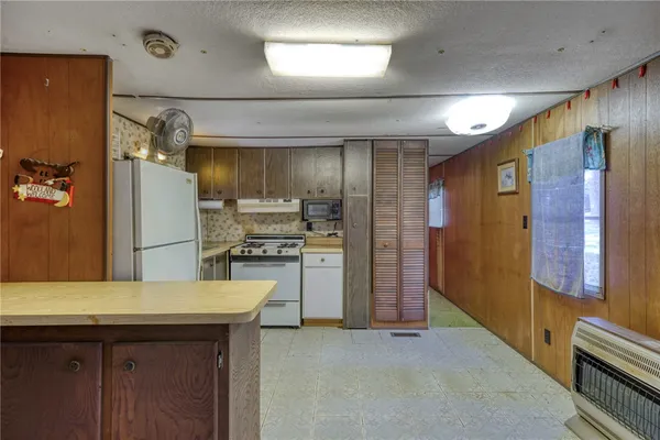 a bedroom with a bed and a table