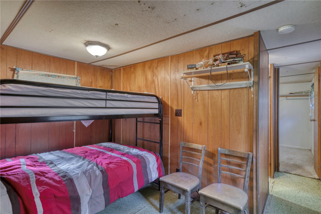 10232 Riley Green Road Franklin, TX 77856 - Photo 28 of 40 a bedroom with a bed and a table