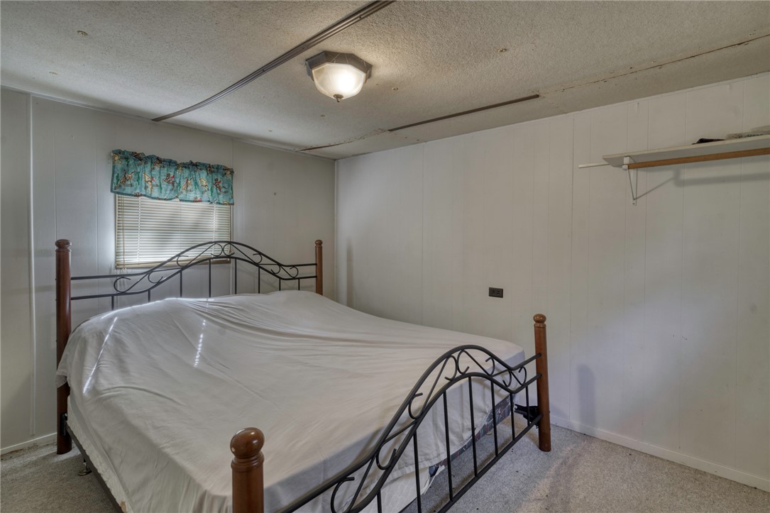 10232 Riley Green Road Franklin, TX 77856 - Photo 30 of 40 a bedroom with a bed and a window