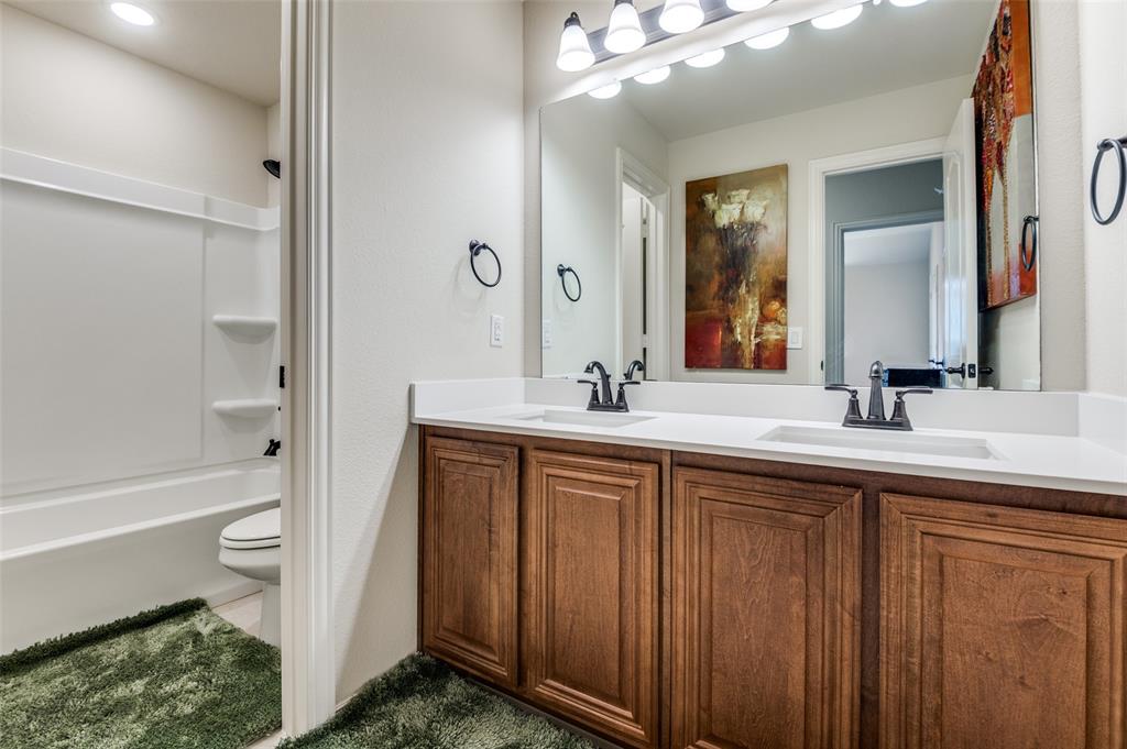 3822 Myrtle Way Kaufman, TX 75142 - Photo 31 of 39 a bathroom with a sink a toilet and a large mirror