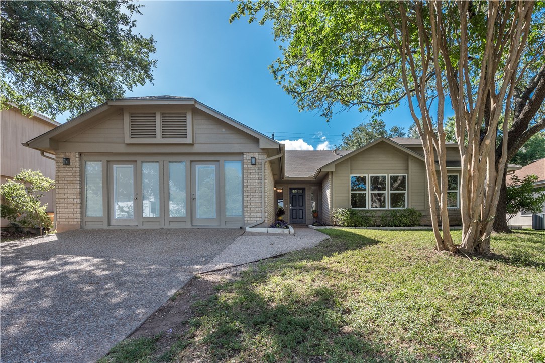 13009 Broughton Way Austin, TX 78727 - Photo 1 of 1 a front view of a house with yard and green space