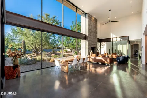 a view of swimming pool with a lounge chairs