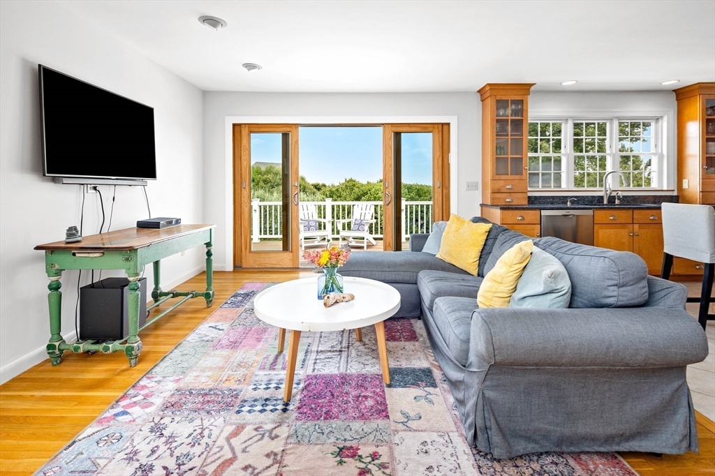 324 Hatherly Road Scituate, MA 02066 - Photo 5 of 15 a living room with furniture and a flat screen tv