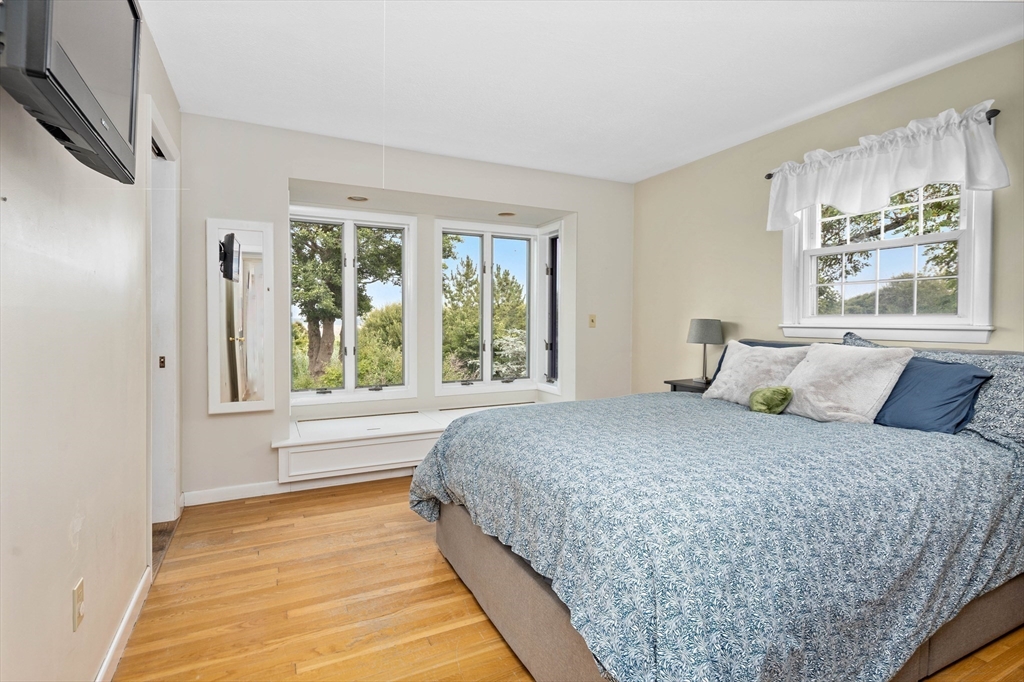 324 Hatherly Road Scituate, MA 02066 - Photo 8 of 15 a bedroom with a large bed and a large window