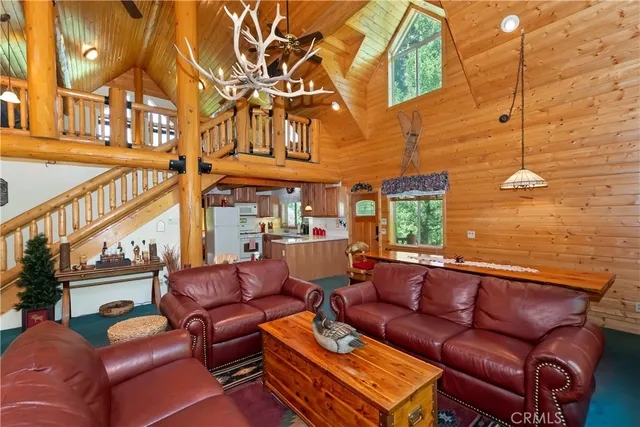 a outdoor living area with patio a couch and a fireplace