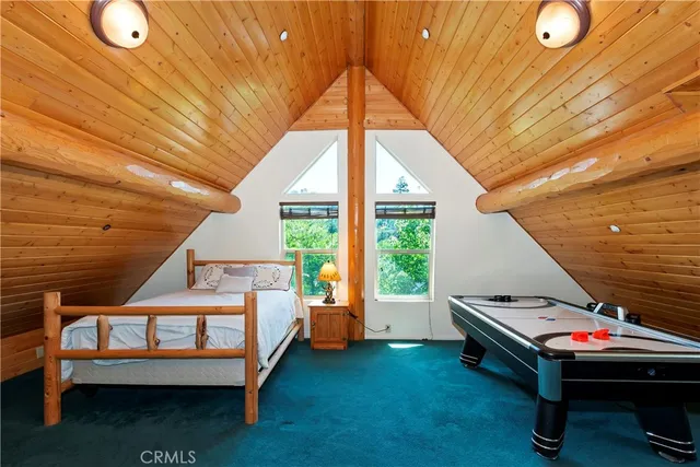 a bedroom with furniture and a window