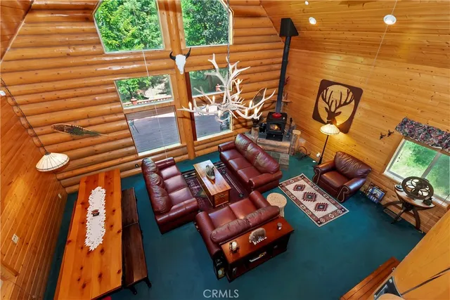 a bedroom with two beds and a baby crib