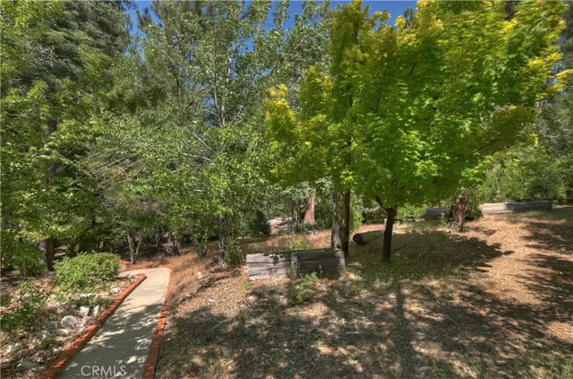 a view of outdoor sitting space and wooden deck