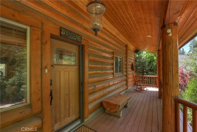 a view of a house with wooden floor and wooden fence