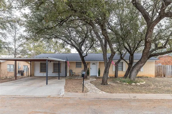 front view of house with a tree