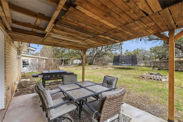 a view of yard with seating area