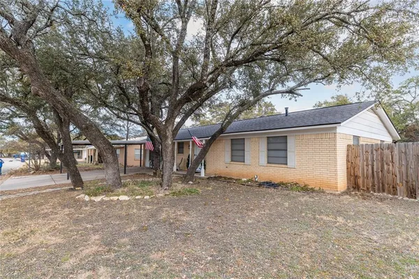 a house with trees in front of it