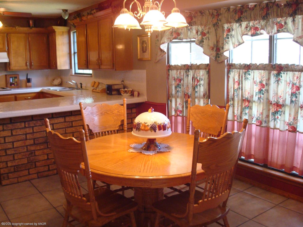 5100 Navajo Trail Amarillo, TX 79110 - Photo 4 of 23 a outdoor dining space with furniture and wooden floor