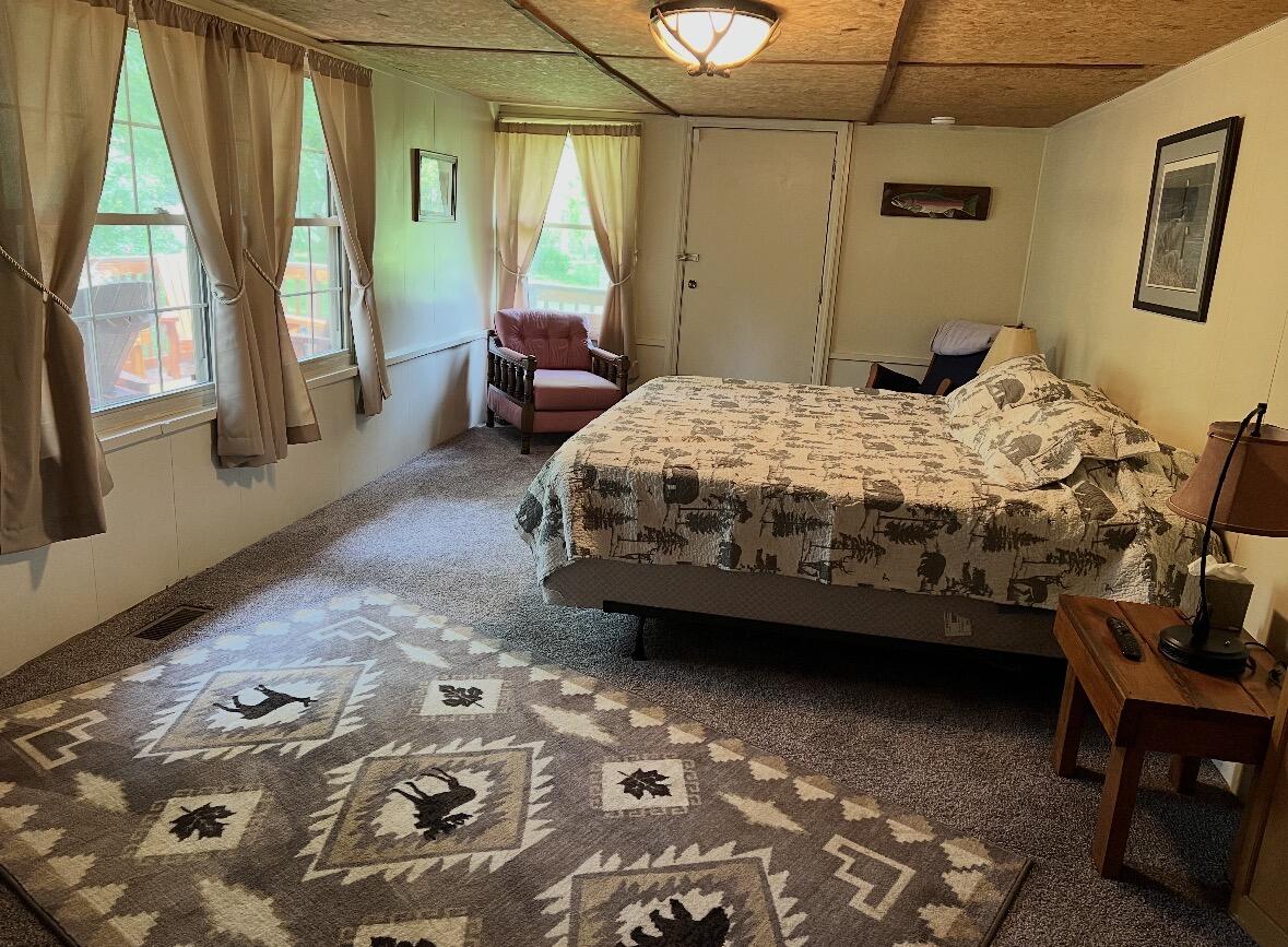 504 Dunbrack Circle Covington, VA 24426 - Photo 5 of 7 a bedroom with a bed chair and a large window