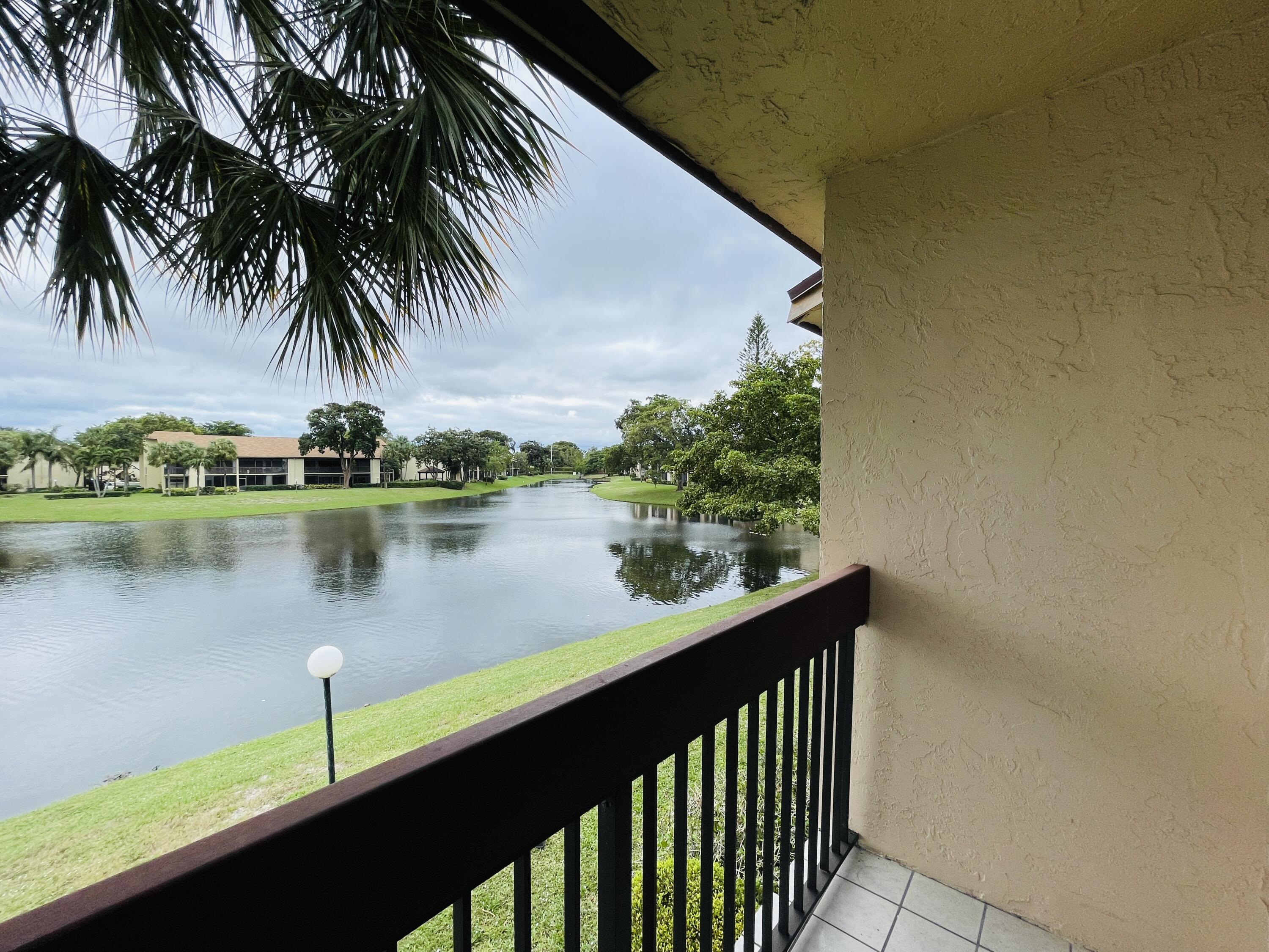 2297 Southwest 15th Street, Unit 122 Deerfield Beach, FL 33442 - Photo 18 of 47 a balcony view with a lake view