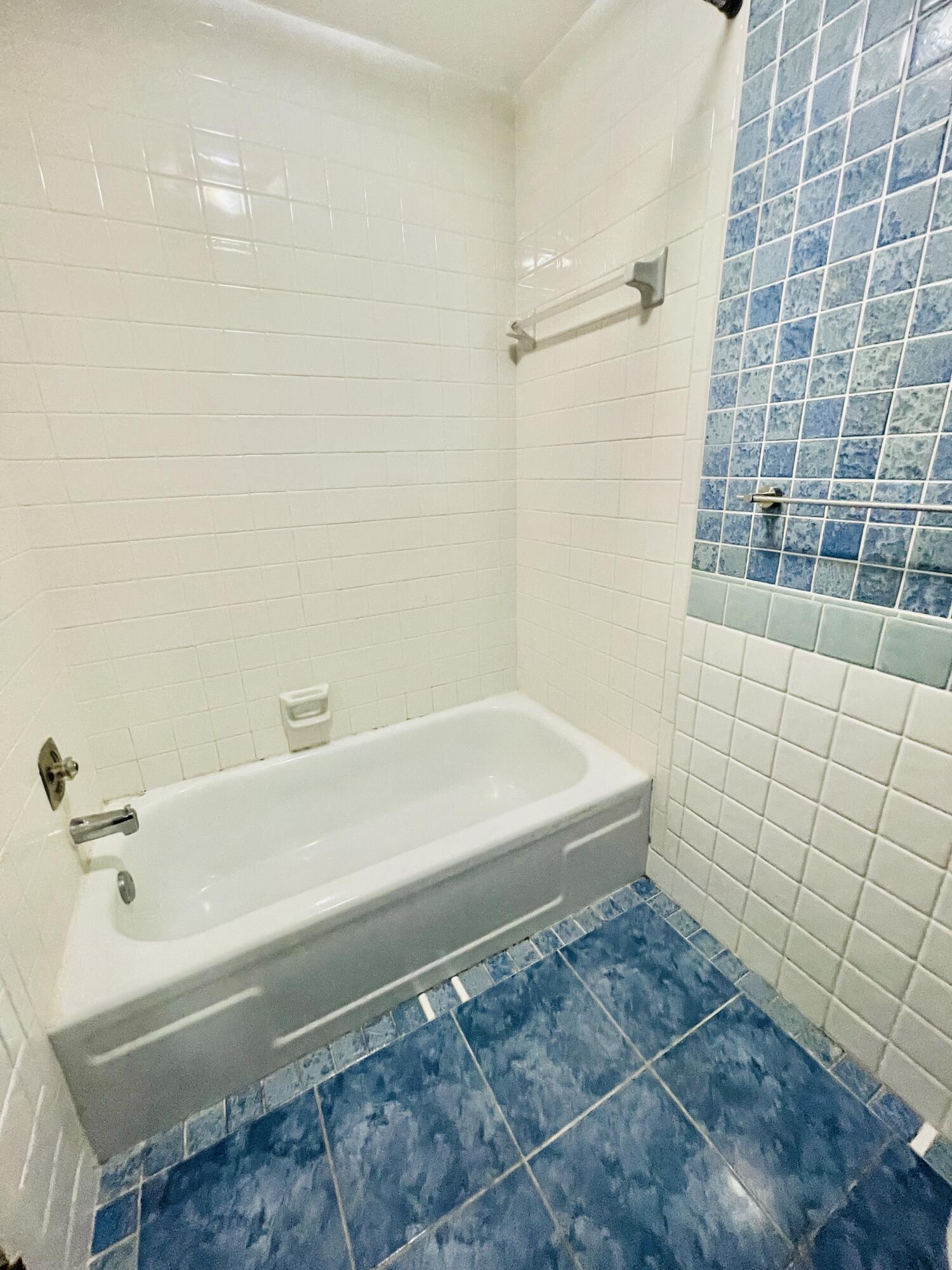 2297 Southwest 15th Street, Unit 122 Deerfield Beach, FL 33442 - Photo 23 of 47 a bathroom with a bathtub and shower