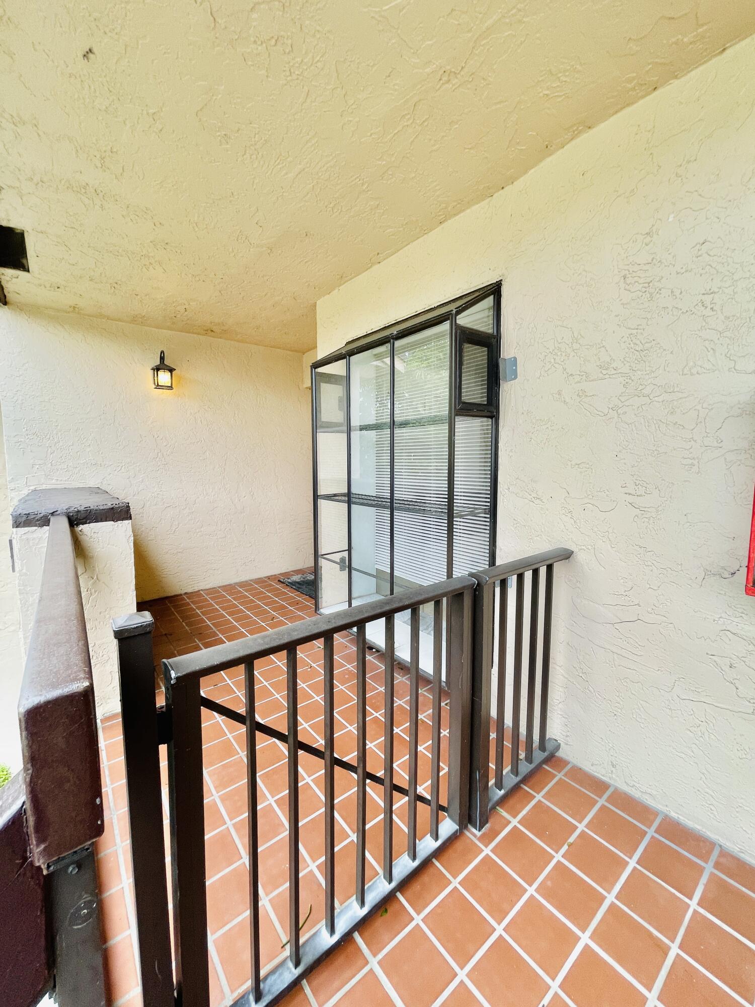 2297 Southwest 15th Street, Unit 122 Deerfield Beach, FL 33442 - Photo 26 of 47 a view of a room with windows