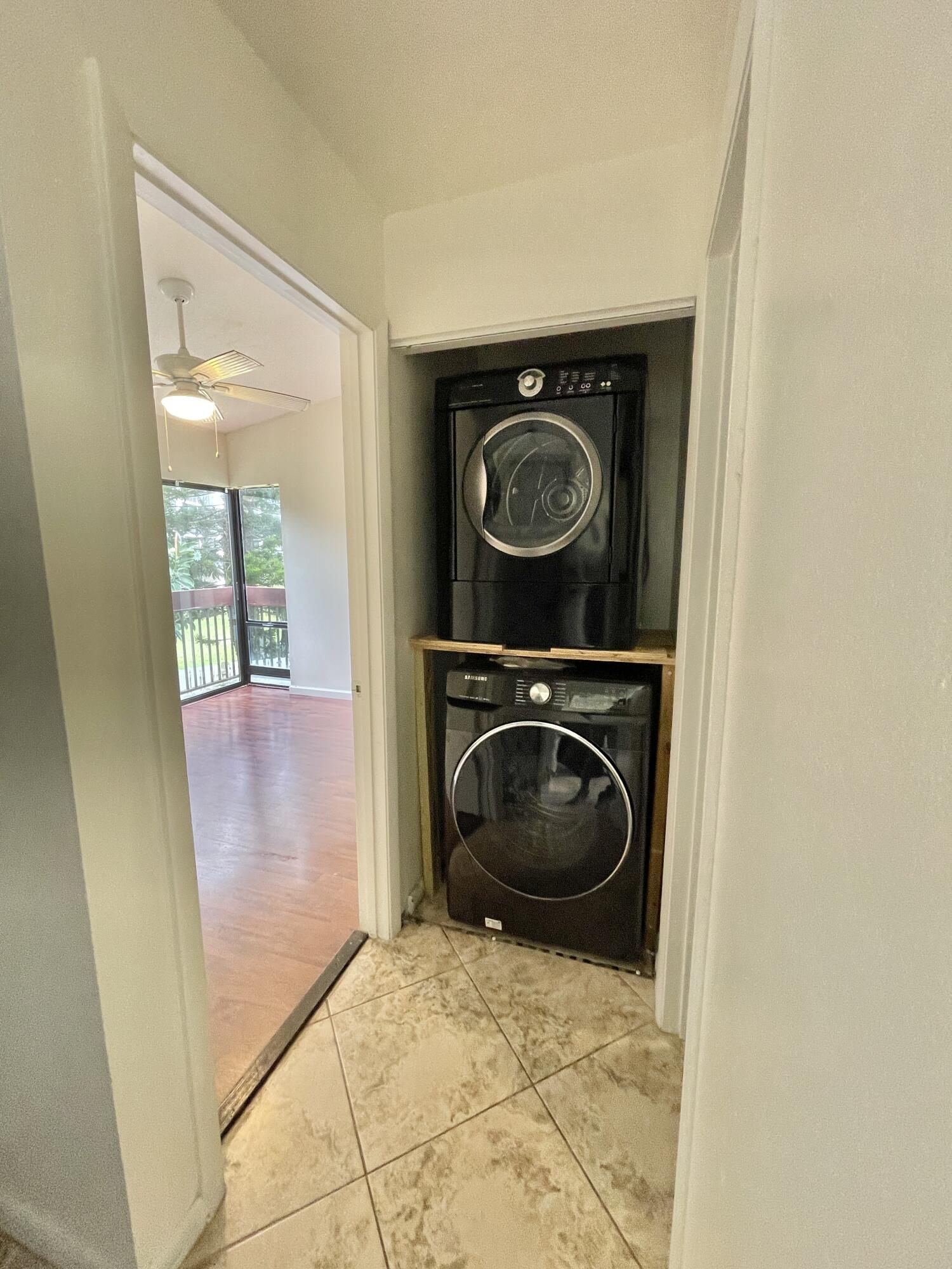 2297 Southwest 15th Street, Unit 122 Deerfield Beach, FL 33442 - Photo 27 of 47 a view of washer and dryer in a utility room