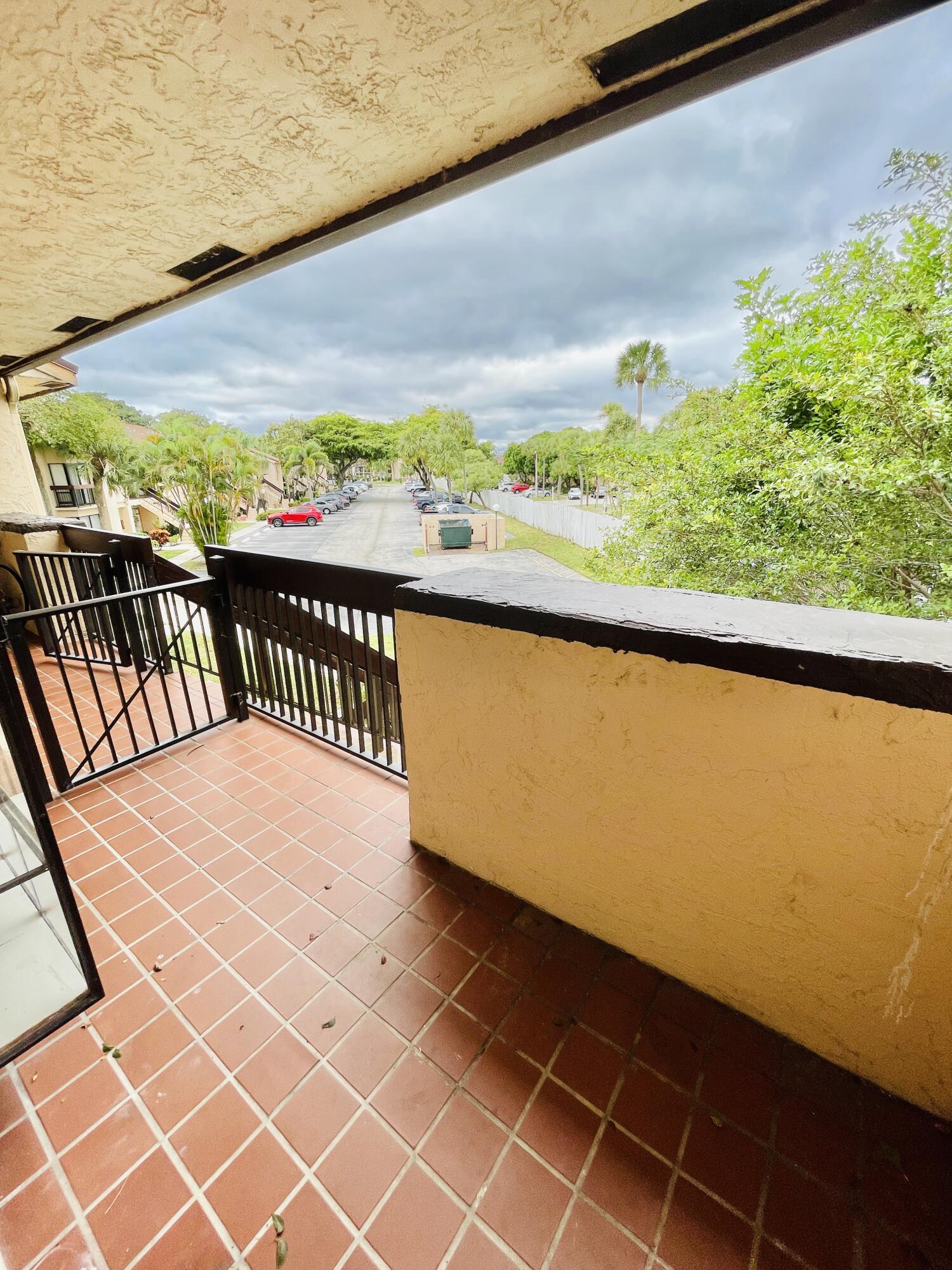 2297 Southwest 15th Street, Unit 122 Deerfield Beach, FL 33442 - Photo 28 of 47 a balcony with an outdoor space