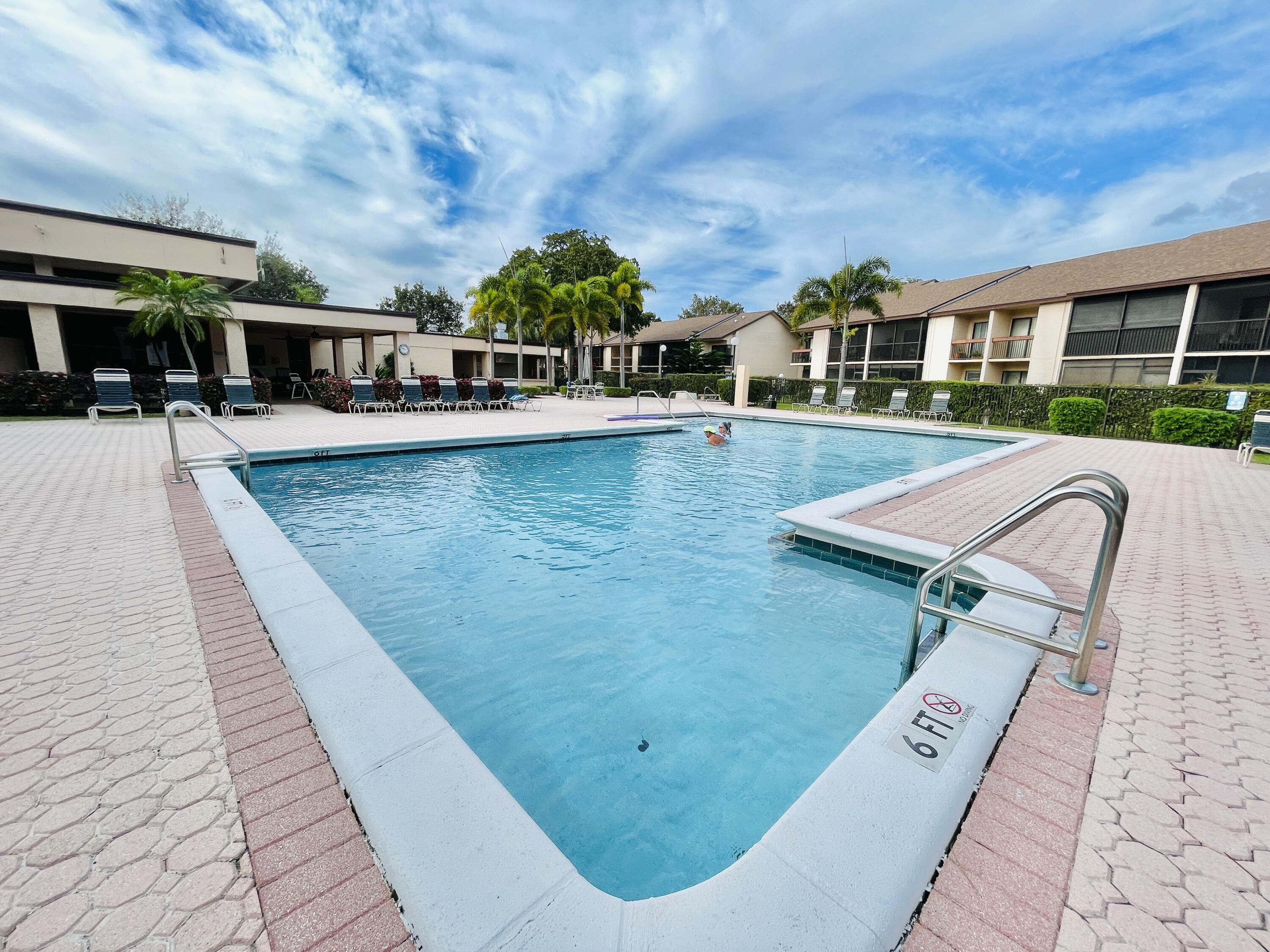 2297 Southwest 15th Street, Unit 122 Deerfield Beach, FL 33442 - Photo 33 of 47 swimming pool view with a seating space