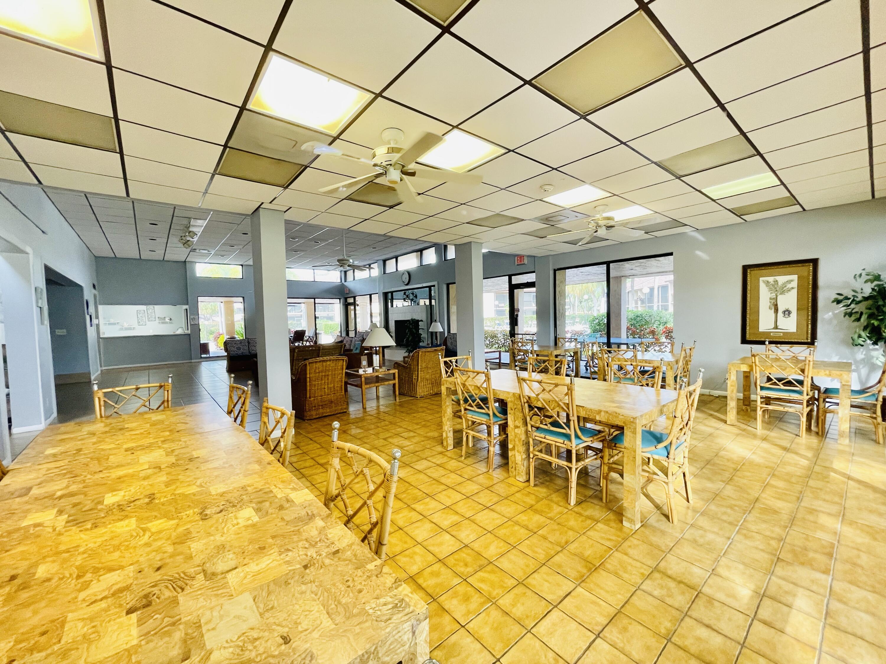 2297 Southwest 15th Street, Unit 122 Deerfield Beach, FL 33442 - Photo 40 of 47 a view of a swimming pool with outdoor seating