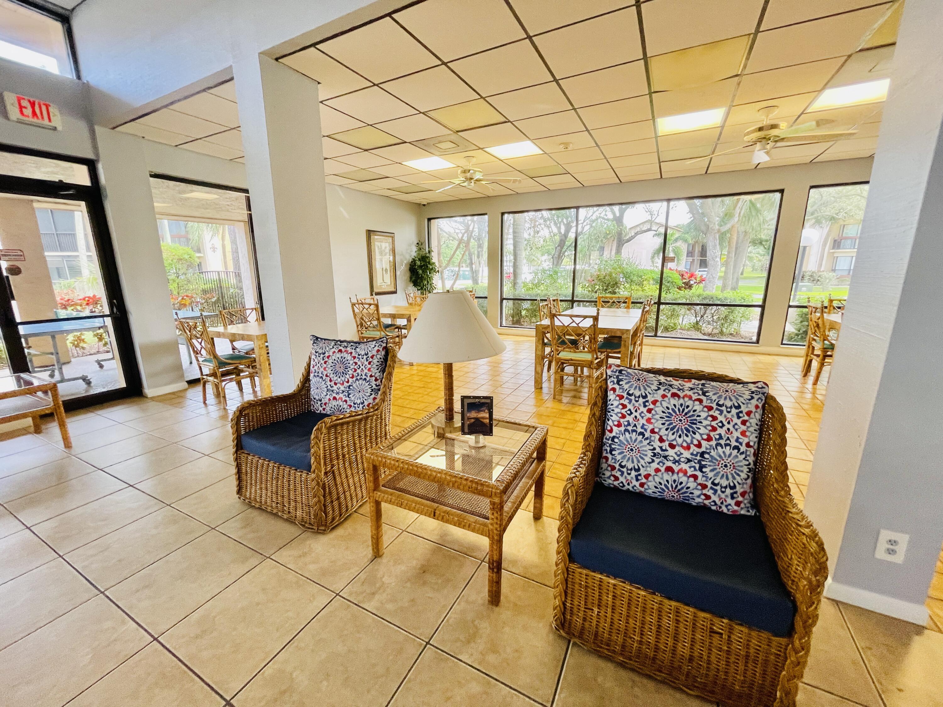 2297 Southwest 15th Street, Unit 122 Deerfield Beach, FL 33442 - Photo 42 of 47 a living room with furniture and a large window
