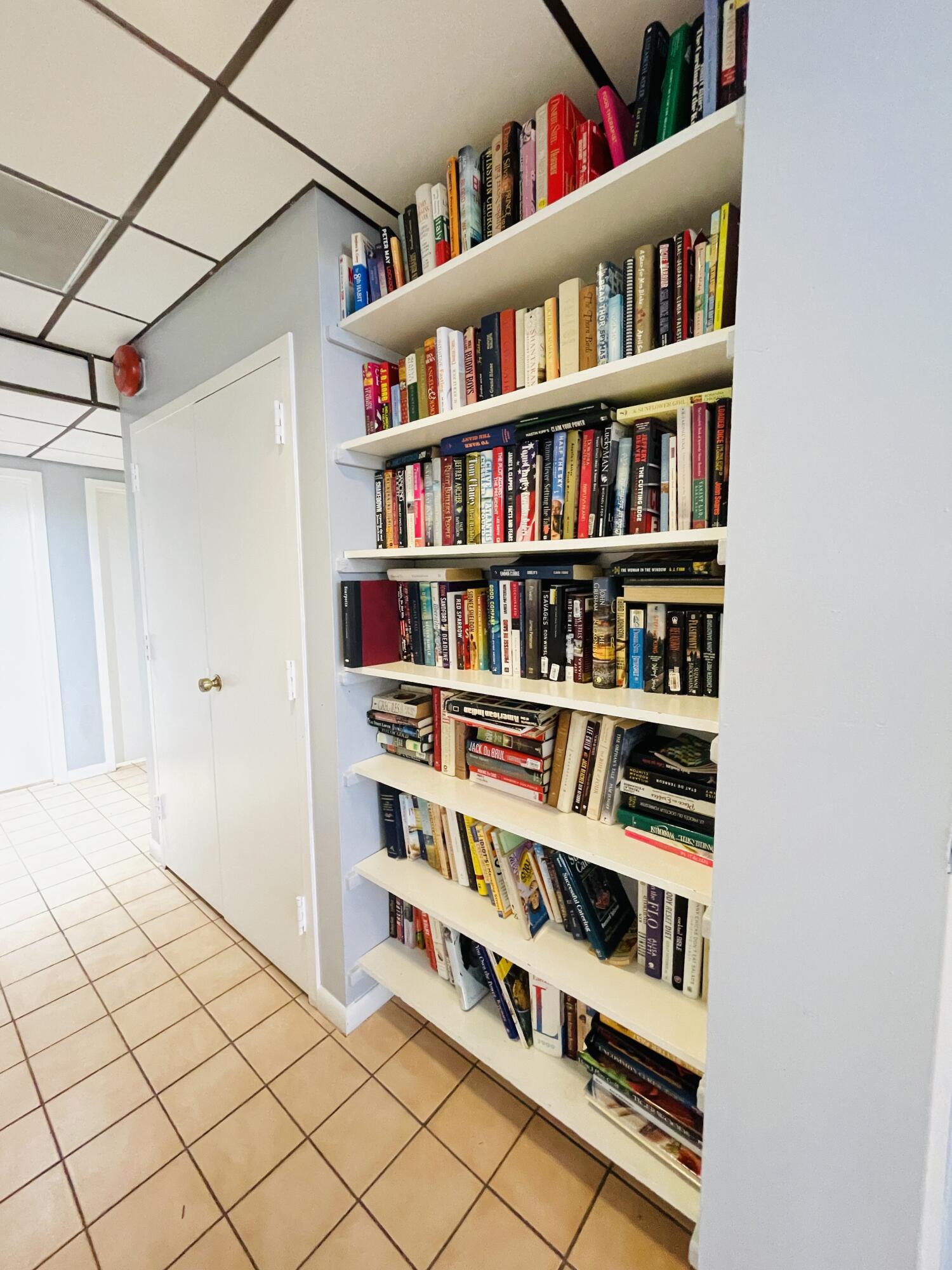 2297 Southwest 15th Street, Unit 122 Deerfield Beach, FL 33442 - Photo 43 of 47 a view of a book shelf with lots of books