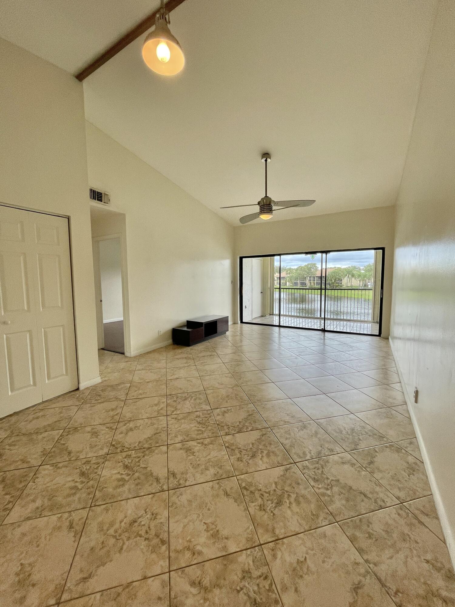2297 Southwest 15th Street, Unit 122 Deerfield Beach, FL 33442 - Photo 6 of 47 a view of an empty room